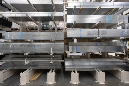 Racks made of rolled metal. Square metal pipes . Profile. A kind of rolling. warehouse of building materials, racks with aluminum profiles