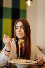 Friends enjoying lunch in the restaurant, eating paste