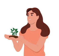 World Soil Day is held annually on December 5. The girl is holding a green plant in her hands. Forest restoration, reforestation planting trees, environment day.