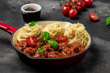 Pan with Italian pasta with tomato sauce and meatballs. Restaurant menu, dieting, cookbook recipe top view