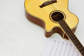 Acoustic guitar with music notes against white background. Love and music concept.