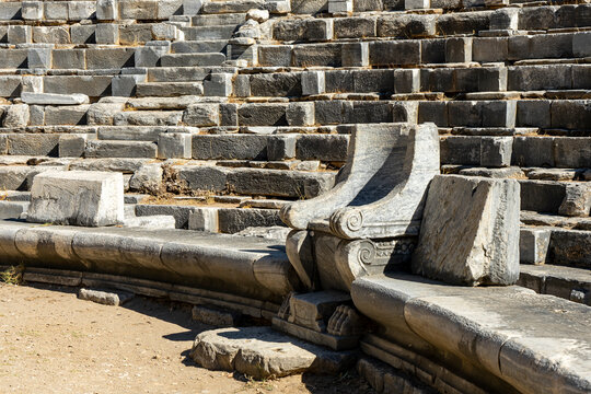 Marble armchair (prohedrai) decorated with lions' claws as seating for distinguished guests in ancient theatre of Priene, Aydın, Turkey. 
