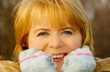 portrait of a smiling, optimistic blond Caucasian woman in her early forties