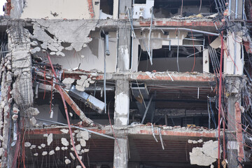 Old building being demolished to make room for new architecture. Construction Demolition Site. Destroyed building, can be used as demolition, earthquake, bomb, terrorist attack or natural disaster