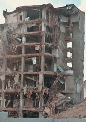 Old building being demolished to make room for new architecture. Construction Demolition Site. Destroyed building, can be used as demolition, earthquake, bomb, terrorist attack or natural disaster
