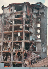 Old building being demolished to make room for new architecture. Construction Demolition Site. Destroyed building, can be used as demolition, earthquake, bomb, terrorist attack or natural disaster