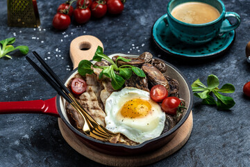 Baked sweet purple potatoes, grilled bacon and fried egg in pan and coffee on white background. Keto breakfast or lunch. Healthy fats, clean eating for weight loss, top view