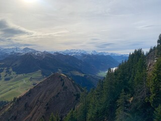 view of mountains in the mountains with the alps in the back from the stanserhorn