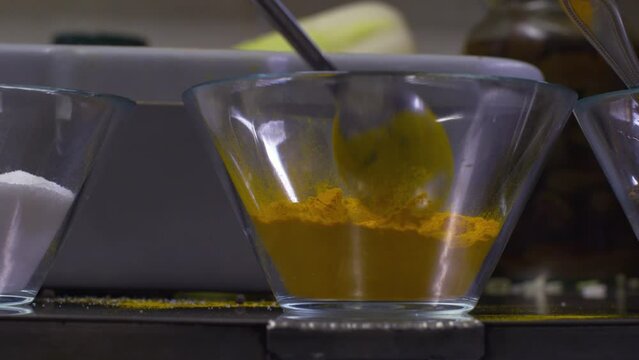 Add a spoon of curry powder tumeric ginger to ingredient bowl recipe step