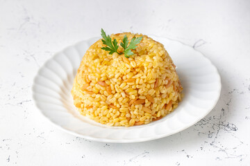 Traditional delicious Turkish food, bulgur pilaf with vermicelli (Turkish name; arpa sehriyeli bulgur pilavi)