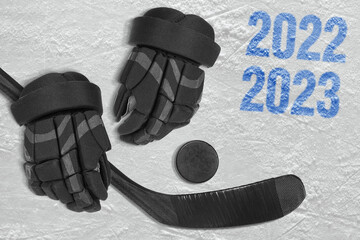 Stick, puck and hockey gloves