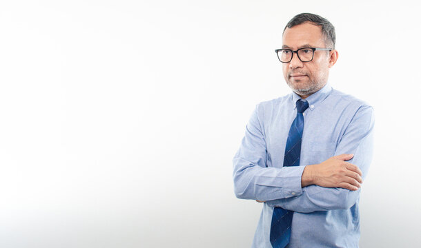 40-50 years old Asian businessman folded his arms and smiled happily after successfully investing in finance, banking, real estate, oil, petroleum. Copy space, portrait, handsome, White background