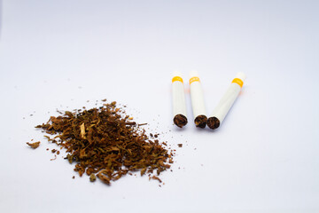 Cigarettes and tobacco powder. Isolated on white background