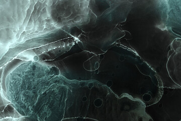 Alcohol ink abstract dark background. Black acrylic paint in water. Texture of marble. Print pattern