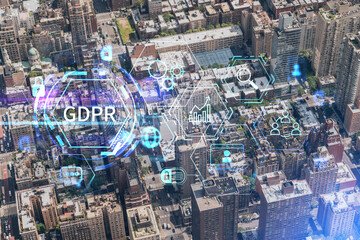 Aerial top view of New York City building roofs. Bird's eye view from helicopter of metropolis cityscape. GDPR hologram, concept of data protection regulation and privacy for all individuals