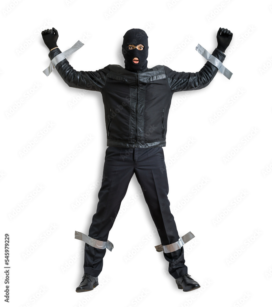 Wall mural Thief or burglar masked with balaclava is caught and is taped to the wall. Isolated on transparent background.