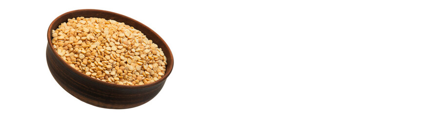 pea groats in a clay bowl. the concept of a good harvest of peas.	