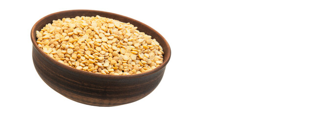 pea groats in a clay bowl. the concept of a good harvest of peas.	