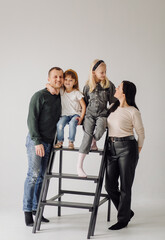 Childhood, fun, family concept. Fashionable sisters posing.