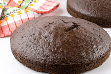 Unfrosted chocolate cakes isolated on white background with selective focus