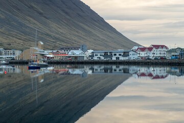 Colorful buildings reflected in the water in Iceland