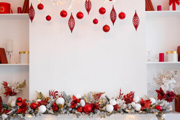Christmas composition. Garland made of red and white balls and fir tree branches on white background. Christmas, winter, new year concept. Flat lay, top view, copy space