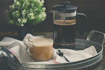 Closeup of a French press coffee in a tray