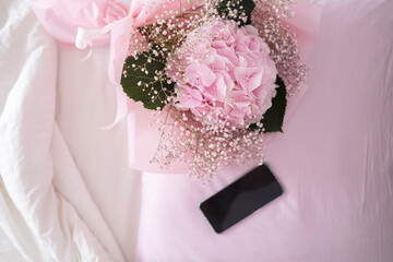 a bouquet of flowers in bed, a gift for a woman, March 8, women's holiday, a bouquet of hydrangeas