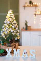 Christmas composition. Xmas sign and fir tree branches on christmas tree background. Christmas, winter, new year concept.