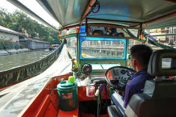 The state of the passenger boat and the view in the canal named Khlong Saen Saep in Bangkok,...