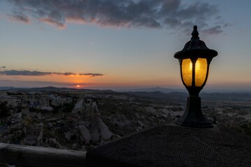 Fototapeta na wymiar Old lamp overlooking the city of Cappadocia, Turkey during sunset