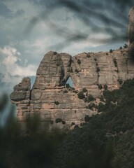 Fototapeta na wymiar Vertical shot of the Montserrat mount on a gloomy day