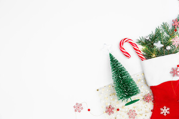 Fototapeta na wymiar Christmas sock with decorative details on white background, copy space.