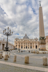 St Peter's basilica and the obelisk in daylight. St Peter's square, Vatican City, Italy