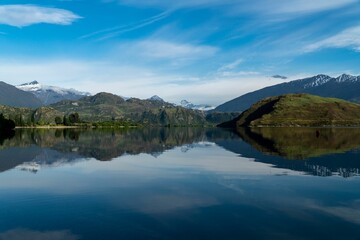 View of the Canadian Rockies reflecting on the lake under the blue sky