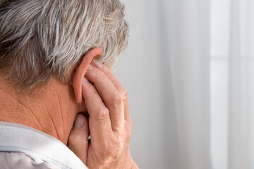 A man has a sore ear close-up