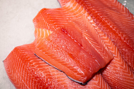 Red fish fillet meat close-up. Trout or salmon, texture and macro photo.