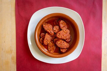 Top-view shot of Chorizo cooked in Cider named Chorizo a la Sidra.