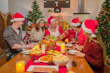 Soft focus concept and background burred. Family having a happy meal to celebrate Christmas and New Year 2023.