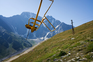 cable car chair with beautiful mountains in the background
