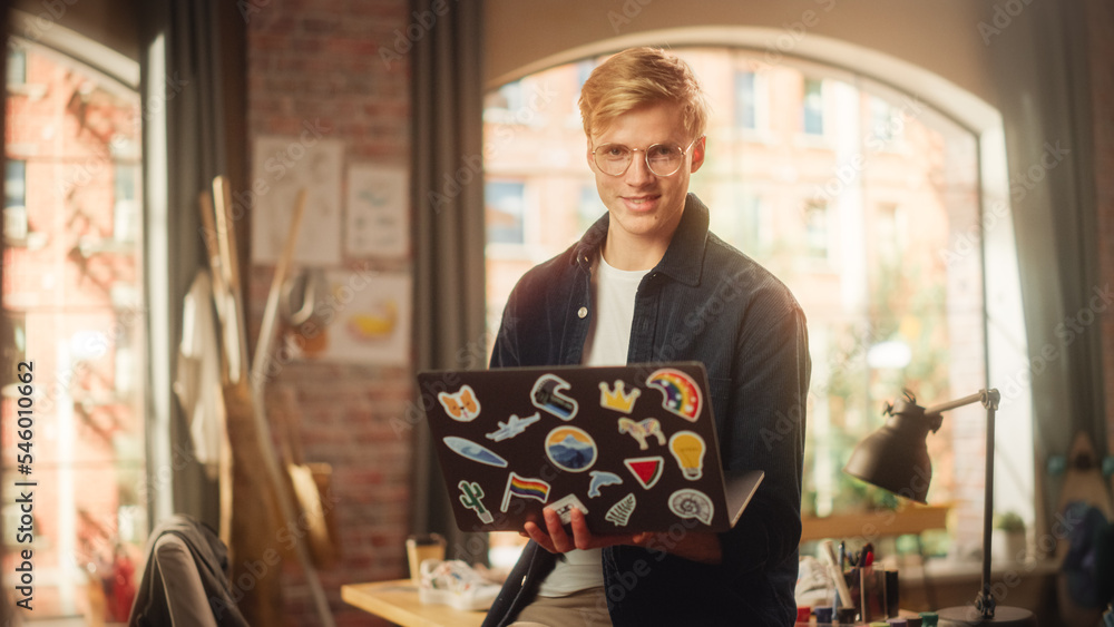 Poster positive male software engineer coding on laptop computer and working with inspiration in his studio