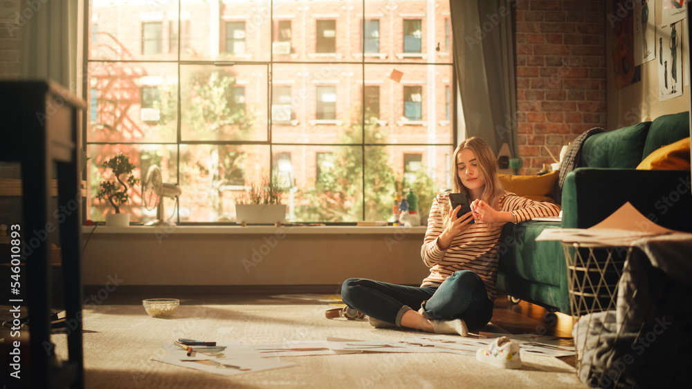 Poster caucasian woman using smartphone while resting at home. female blogger creating content and scrollin