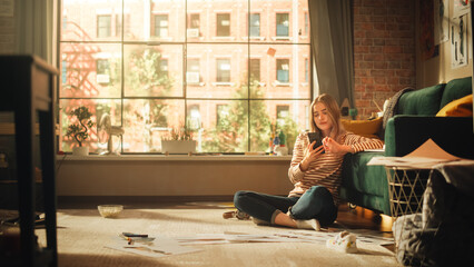 Caucasian Woman Using Smartphone while Resting at Home. Female Blogger Creating Content and...