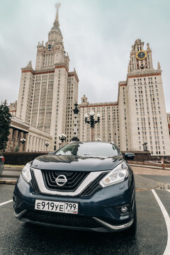 Nissan Murano car, front side view. Dark blue crossover parked on parking lot in front of Lomonosov Moscow State University building. Wide angle view