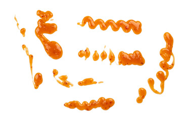 a set of smeared sweet and sour sauce with chili pepper on a white background