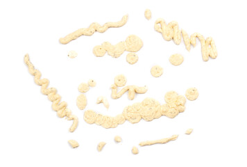 spilled tartar sauce on a white background