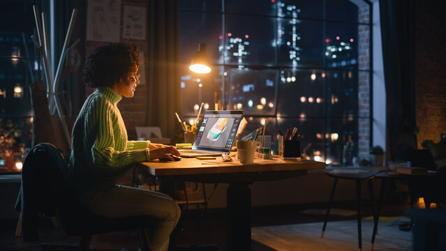 Hispanic Female Designer Changes Colour of 3d Model of the Shoe, Creating Footwear Design on her Laptop Computer During the Evening. Girl Working Remotely. Graphic Designer Concept.