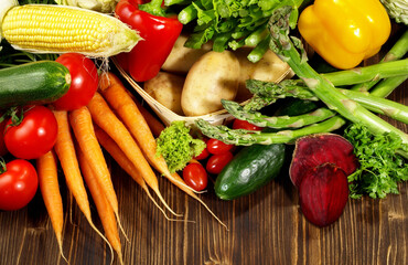 Fresh Mixed Vegetables and Salads on wooden Background