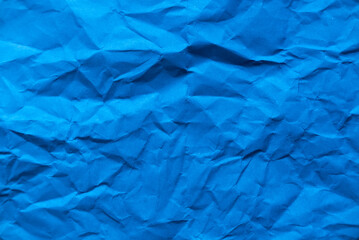 Blue crumpled paper for background.