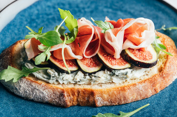 Open Sandwich with Blue Cheese, Figs, Rocket salad leaves and Prosciutto